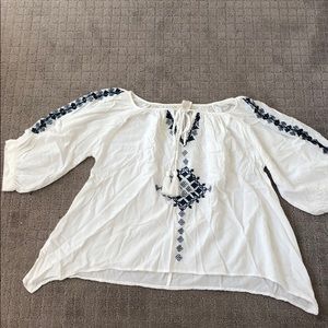 Flowy White Top With Blue Embroidered Detail!